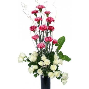 With the purity of your heart for your innocent beautiful love with Clear Glass Vase with 12 Pink Carnations and 20 white Roses.